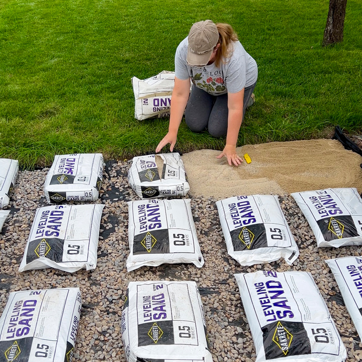 adding leveling sand