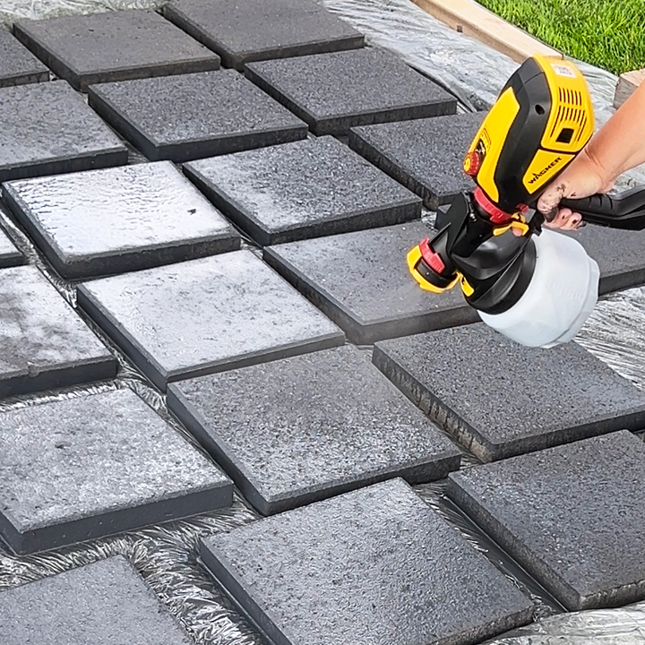 spraying stain with paint sprayer